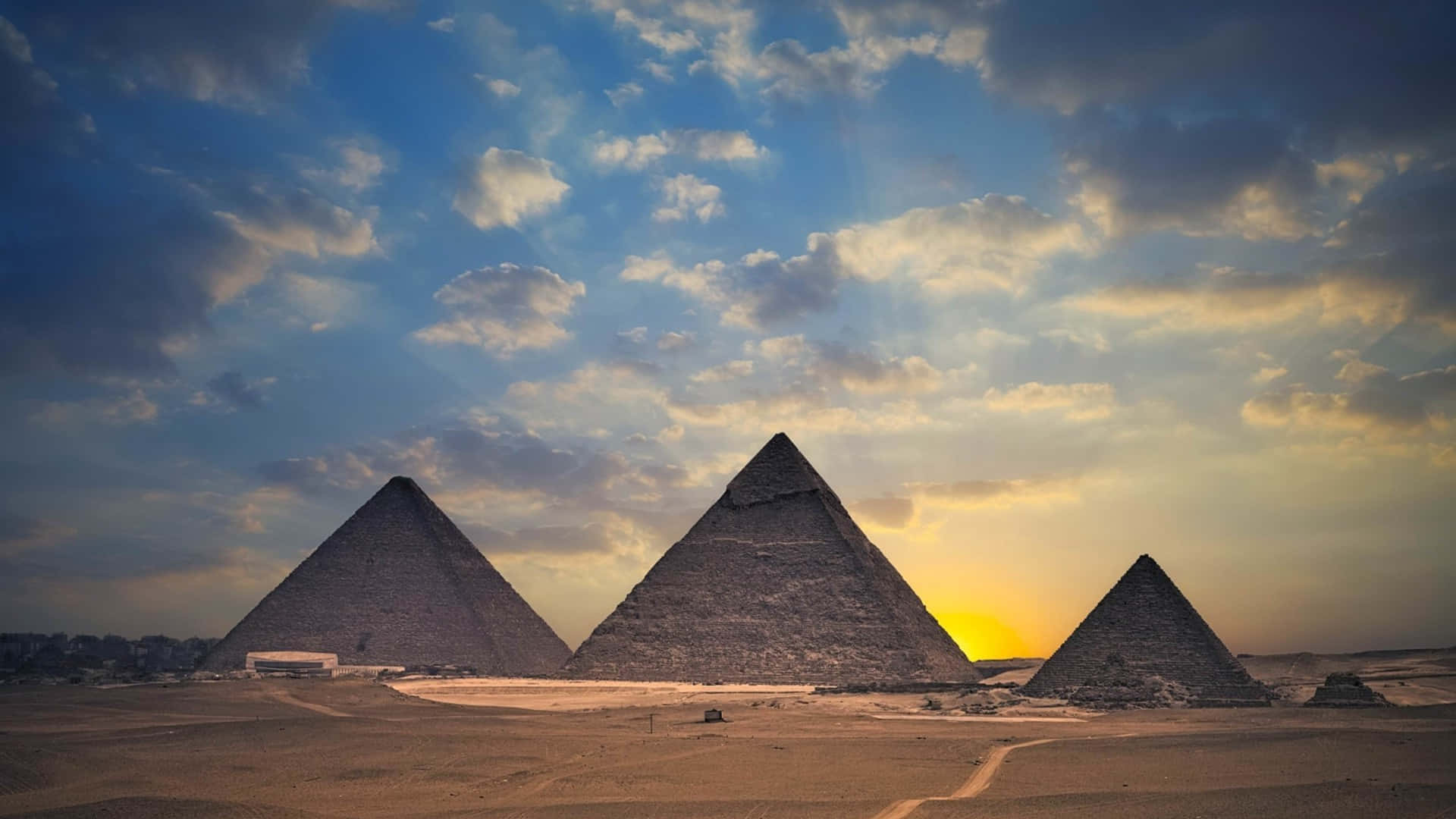The Pyramids Of Giza At Sunset Background