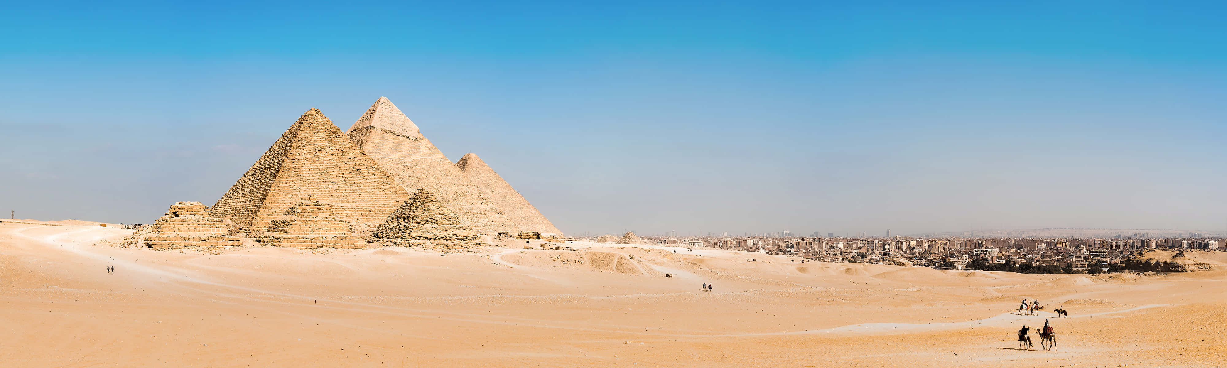 The Pyramids Of Giza Group Of Camel Tours Background
