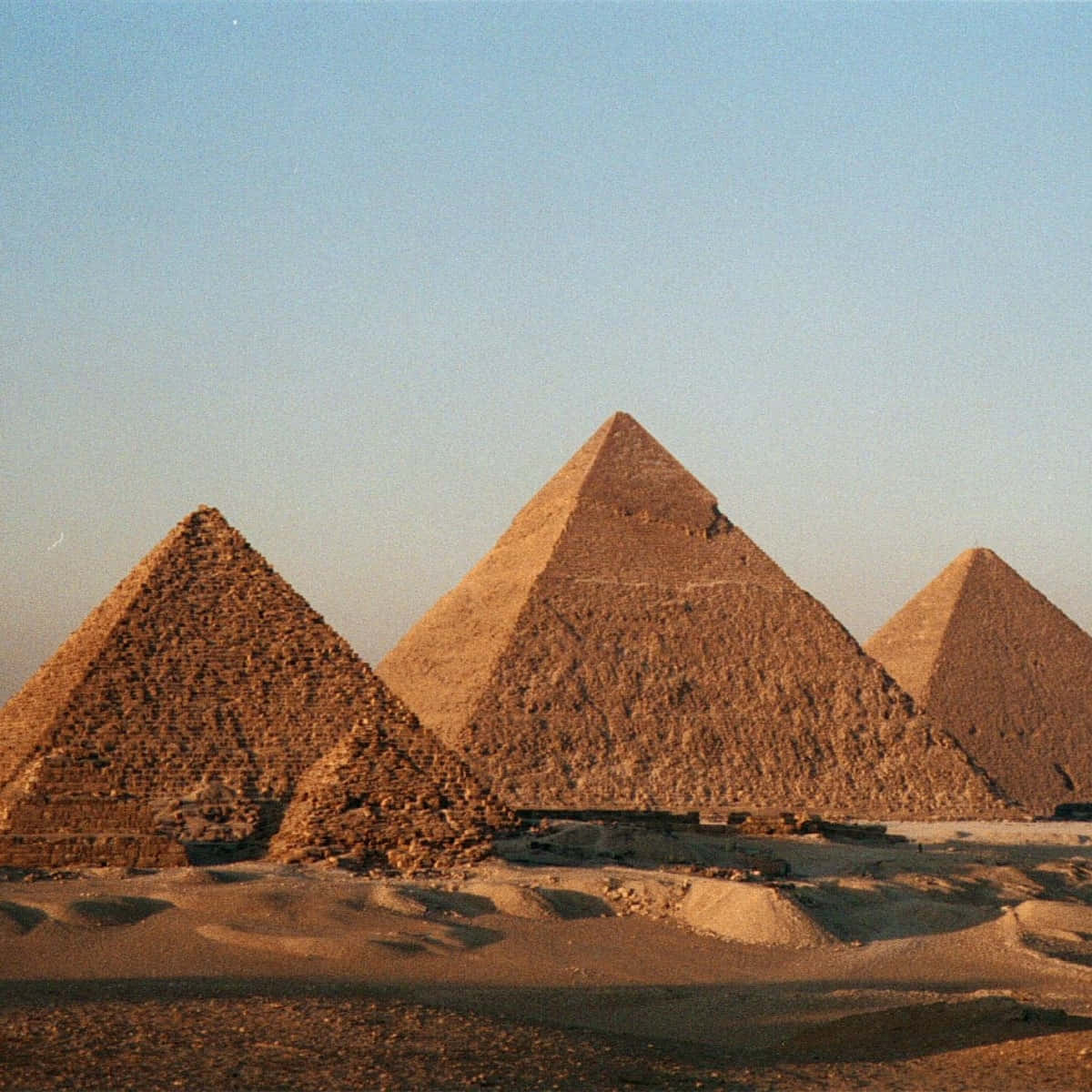 The Pyramids Of Giza Rising Sun Background