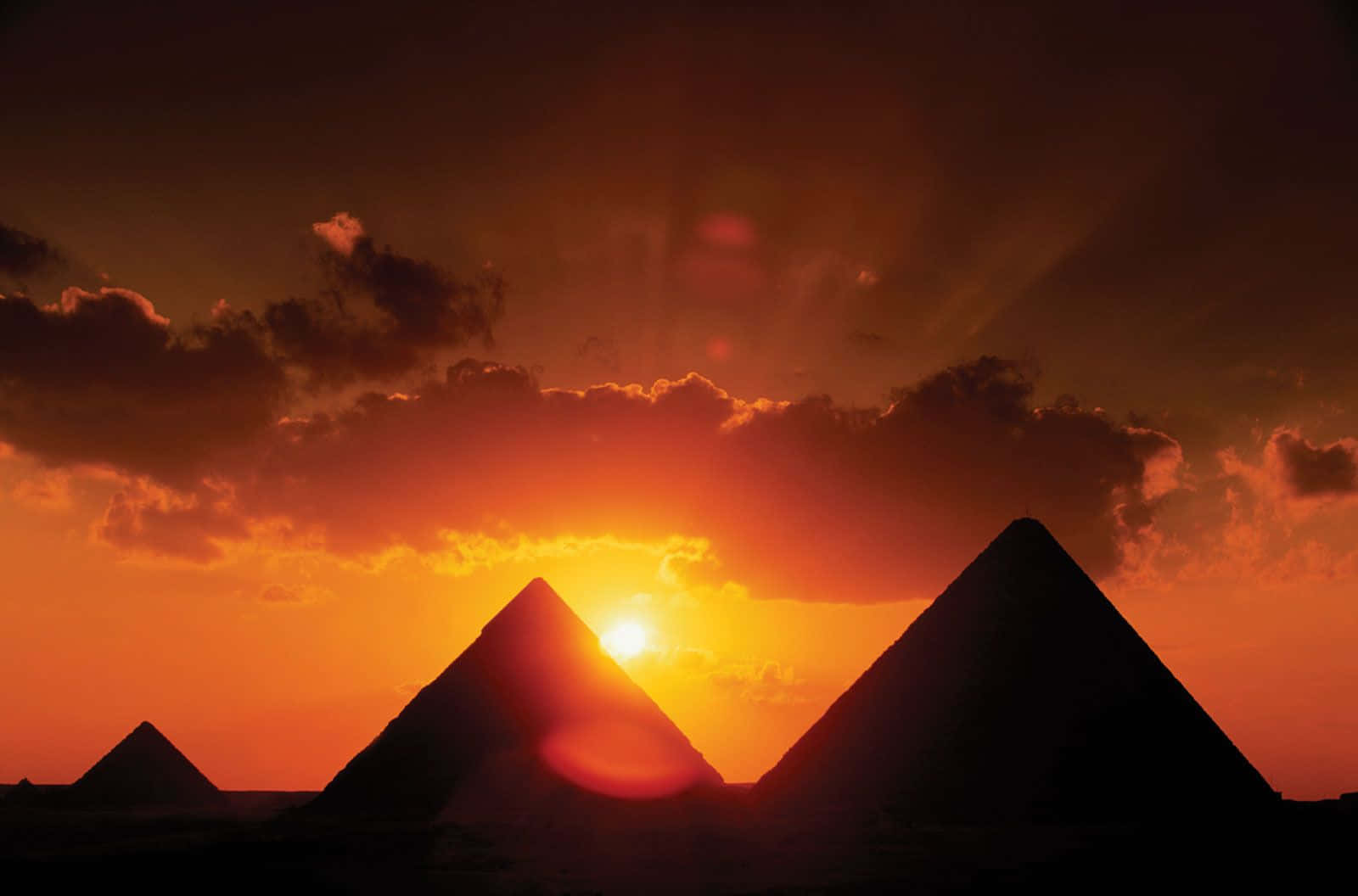 The Pyramids Of Giza Setting Sun Silhouette Background