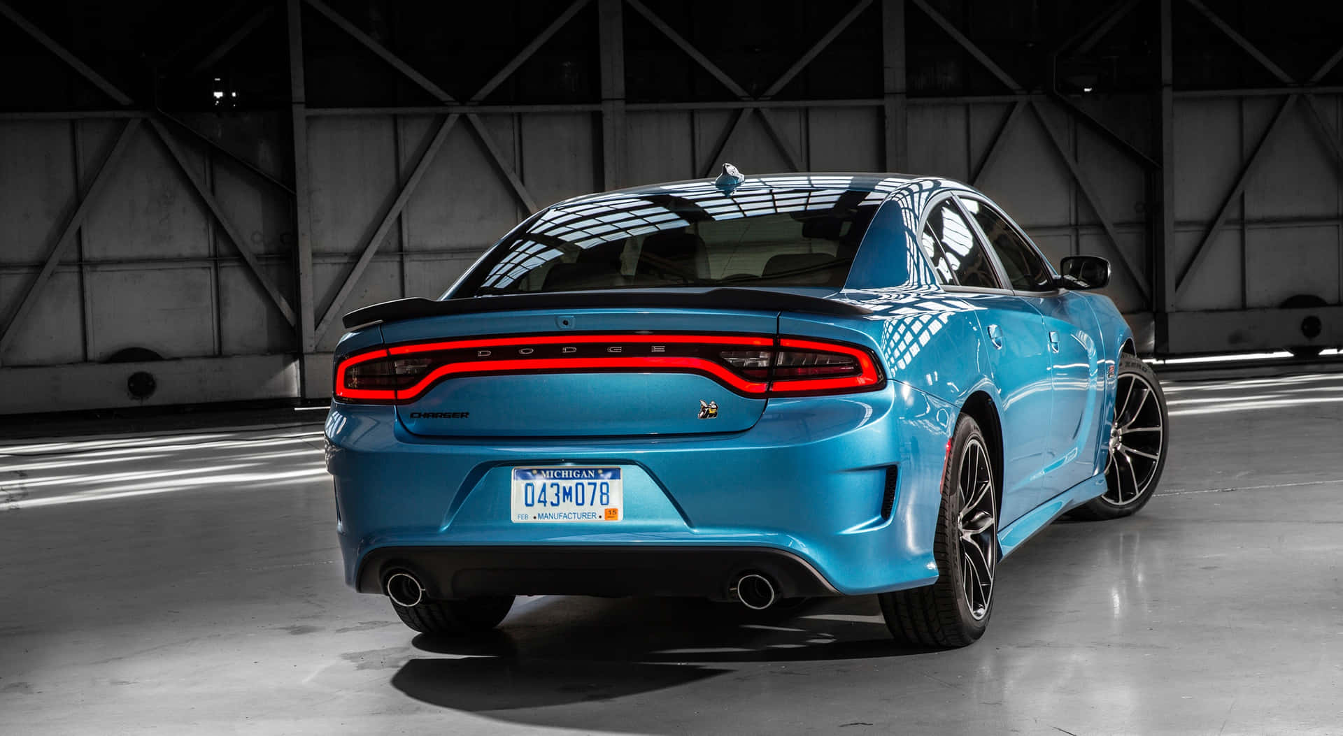 The Rear End Of A Blue Dodge Charger Background