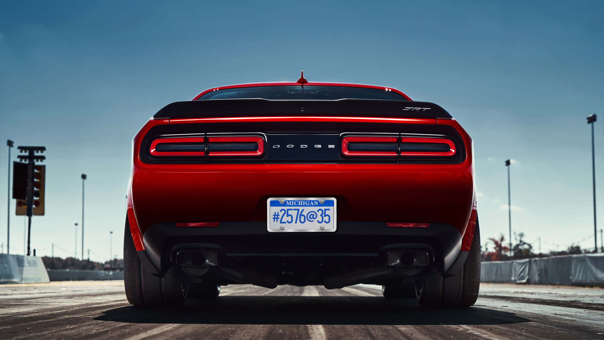 The Rear End Of A Red Dodge Challenger