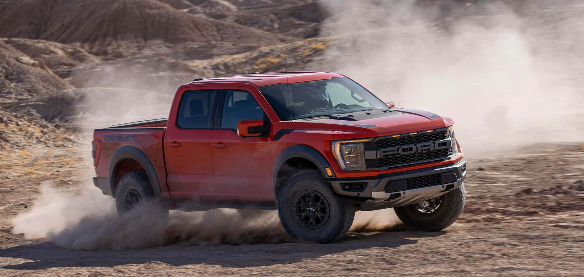 The Red 2019 Ford F-150 Rambo Is Driving Through The Desert Background