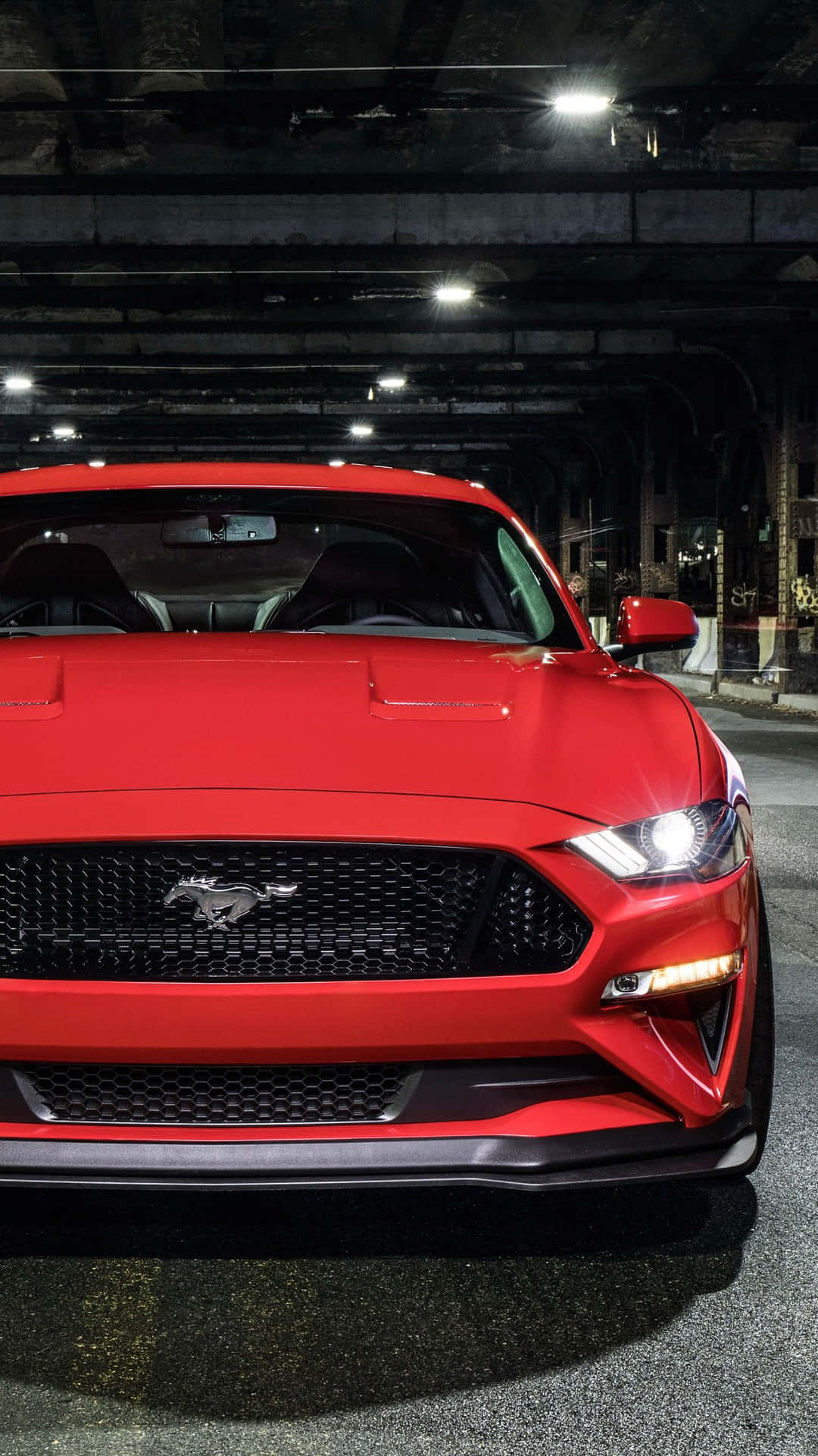 The Red 2019 Ford Mustang Gt Is Parked In A Garage Background