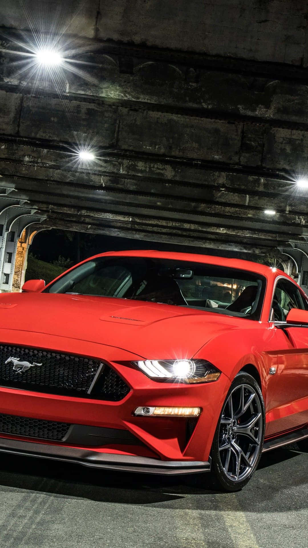 The Red 2019 Ford Mustang Gt Is Parked In A Tunnel Background