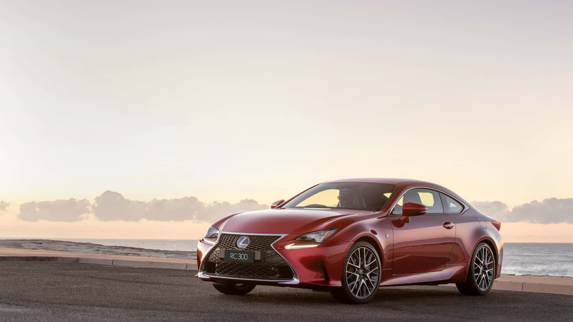 The Red Lexus Rc - F Coupe Is Parked On The Beach