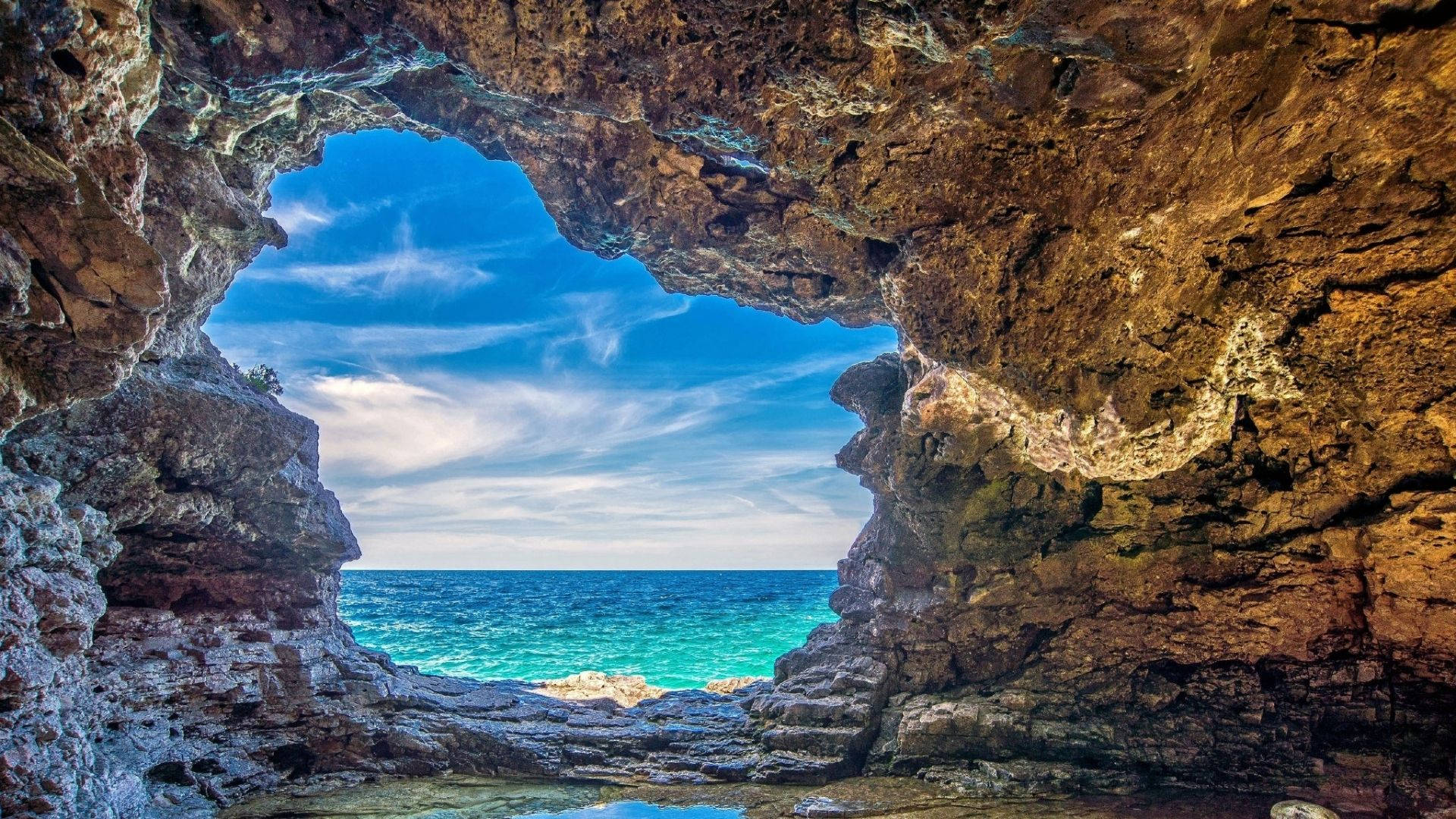 The Serenity Of A Seascape Cave Background