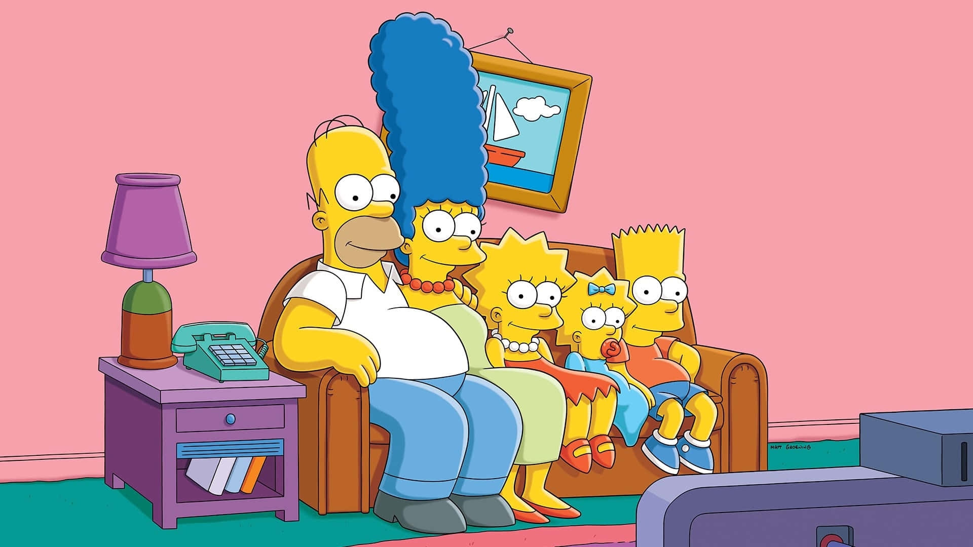 The Simpsons Family Sitting On A Couch