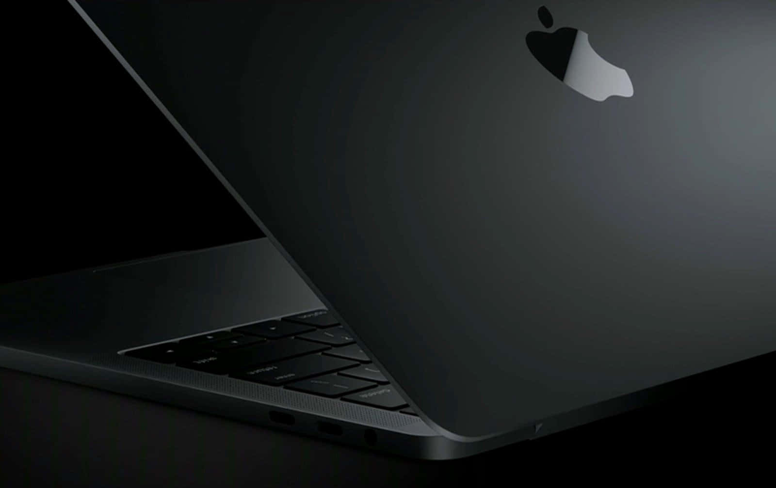 The Sophisticated And Stylish Black Macbook Background