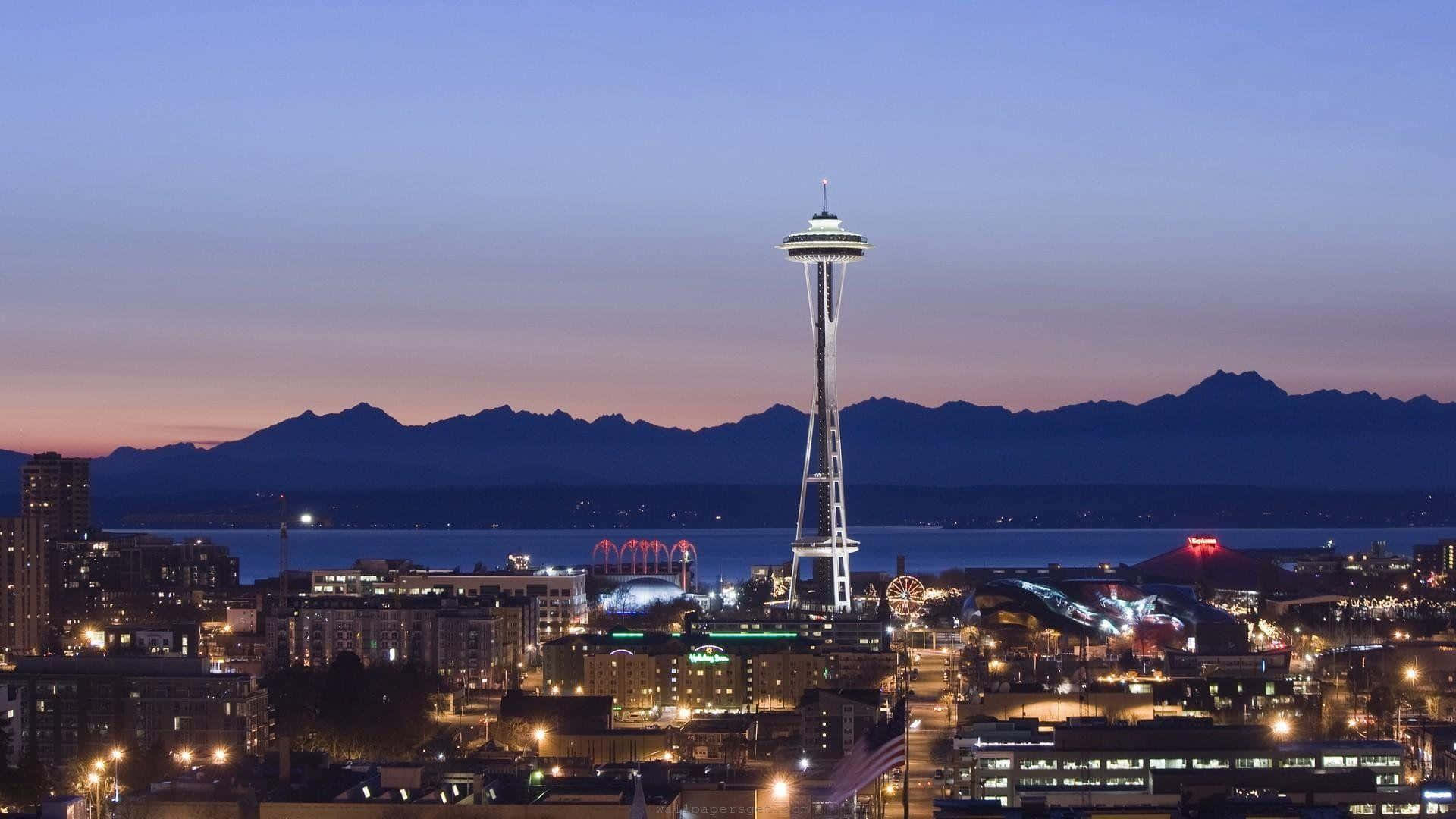 The Space Needle And Seattle At Night Background