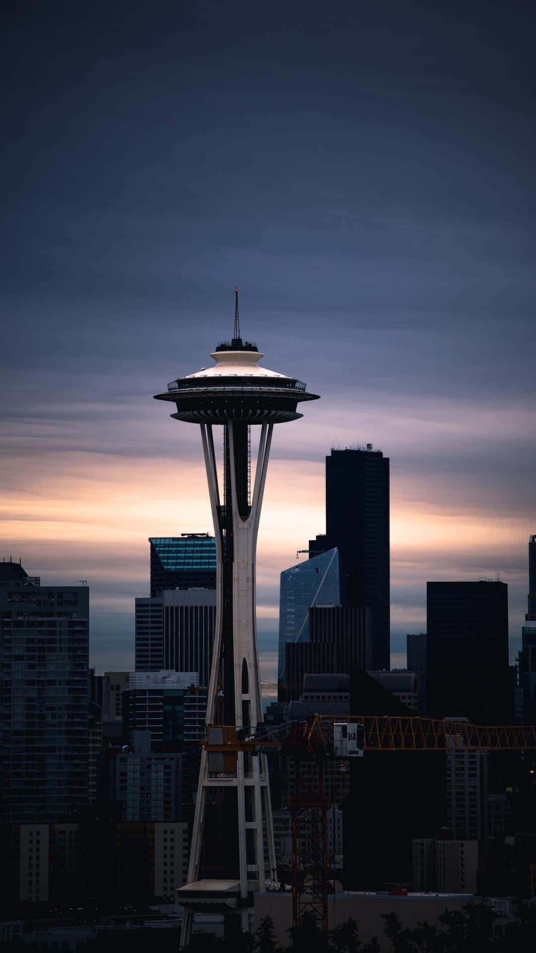 The Space Needle Is Seen In The Sky At Dusk