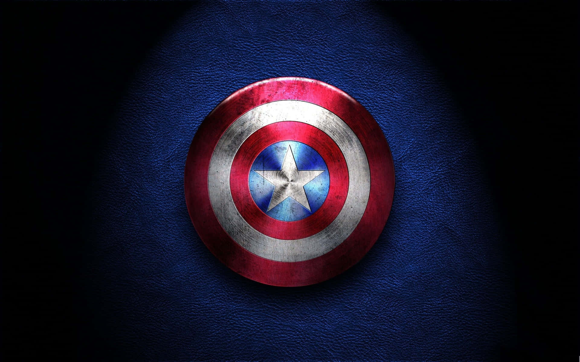 The Symbol Of Strength, Courage And Power: The Captain America Logo Background
