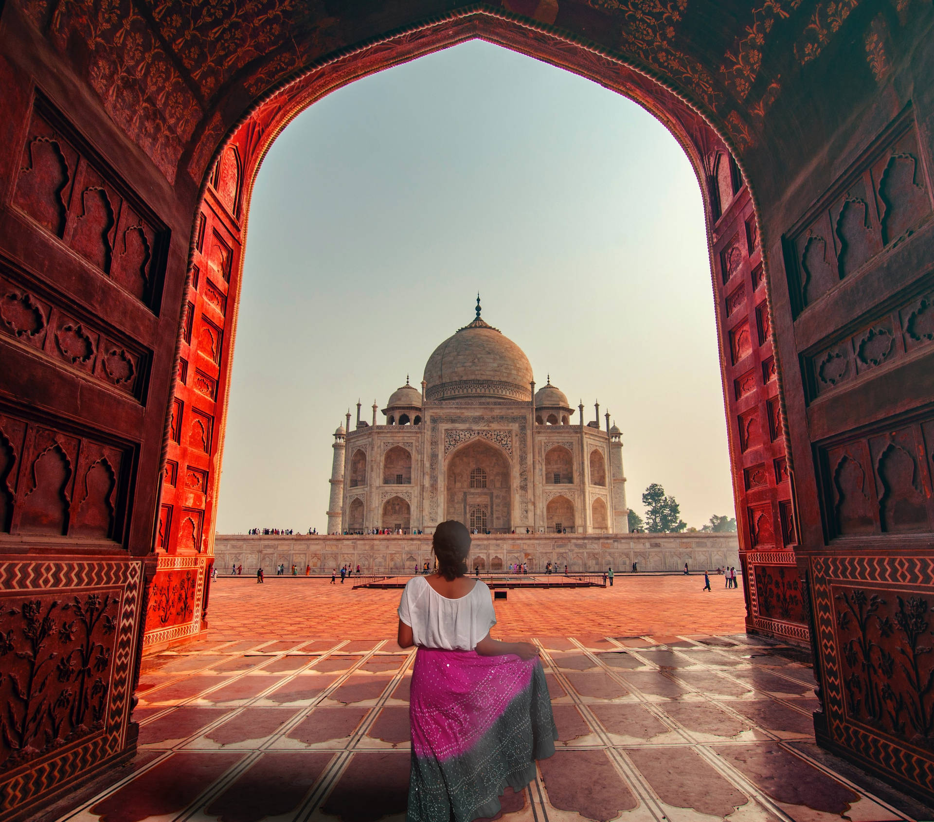 The Taj Mahal Behind A Woman Background