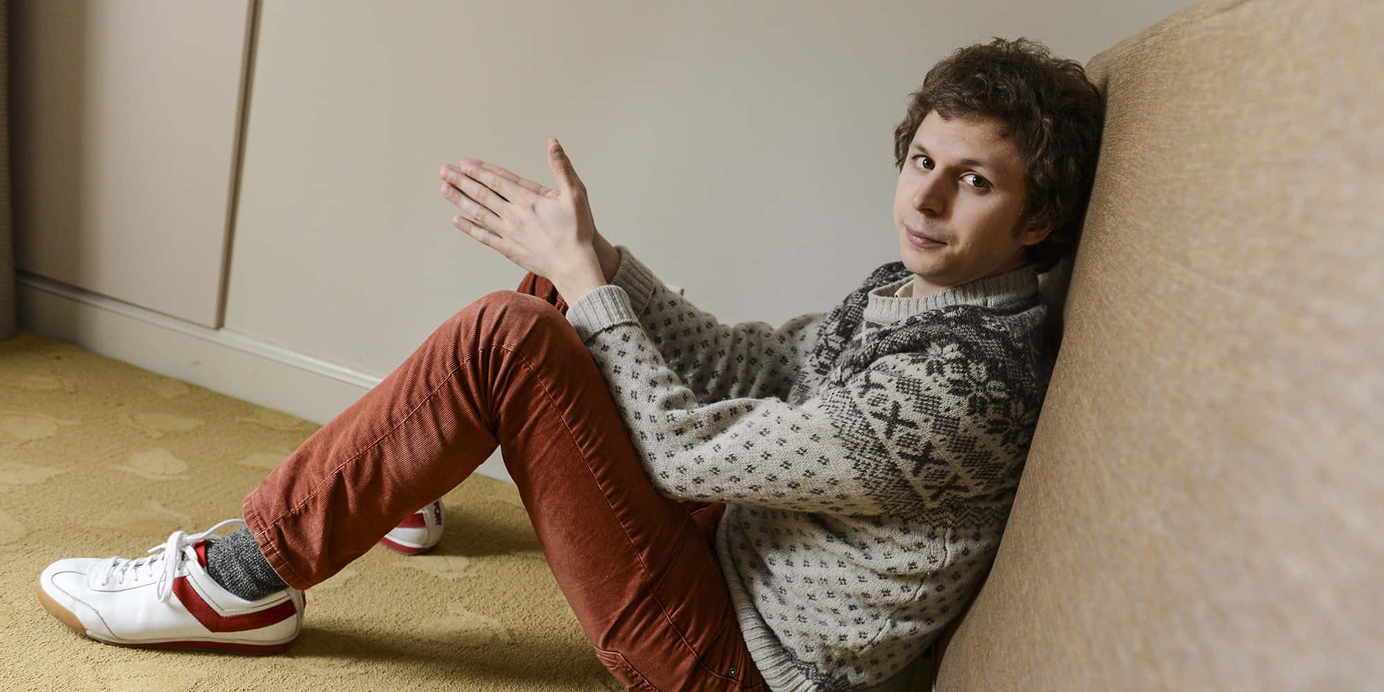 The Talented Michael Cera Gracefully Posing For A Snapshot Background