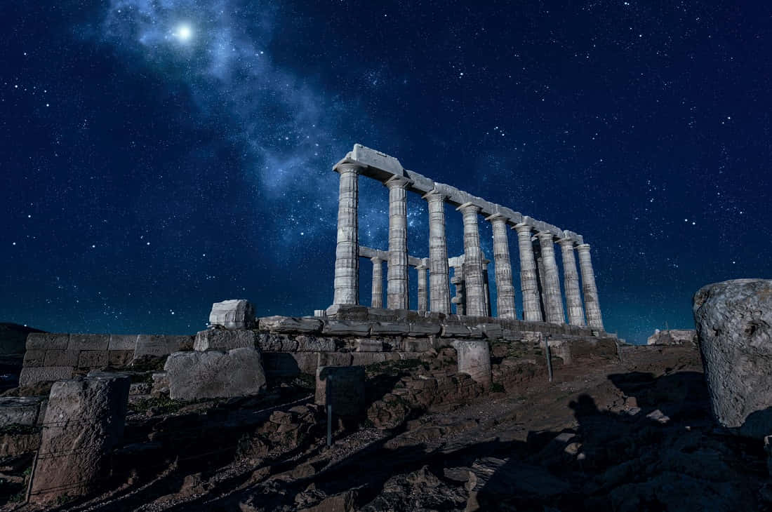 The Temple Of Poseidon At Night Background