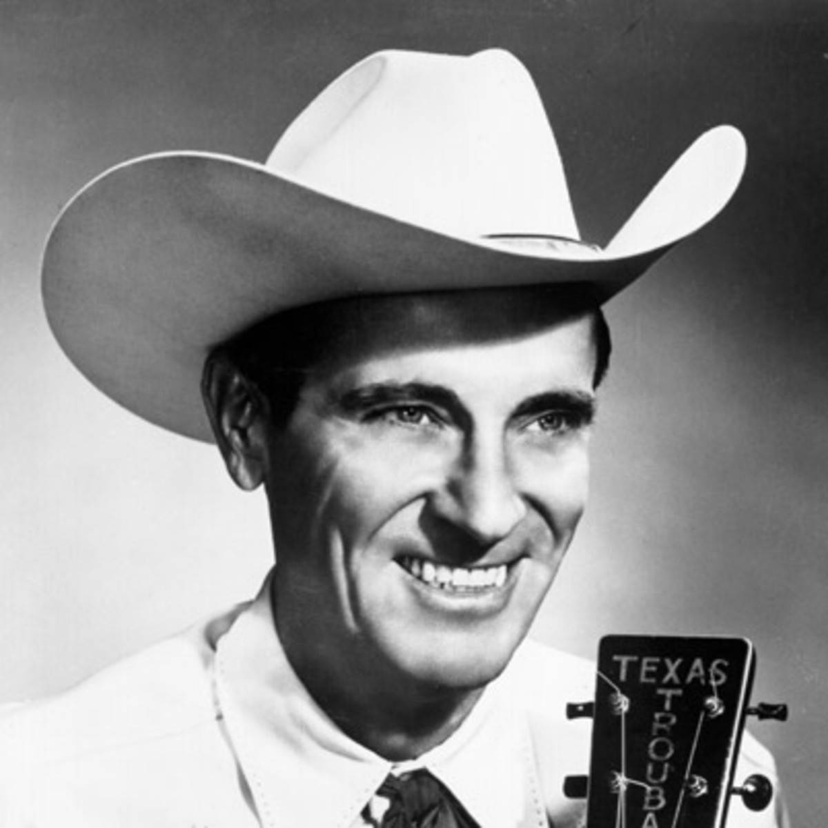 The Texas Troubadour, Ernest Tubb Strumming His Guitar Background