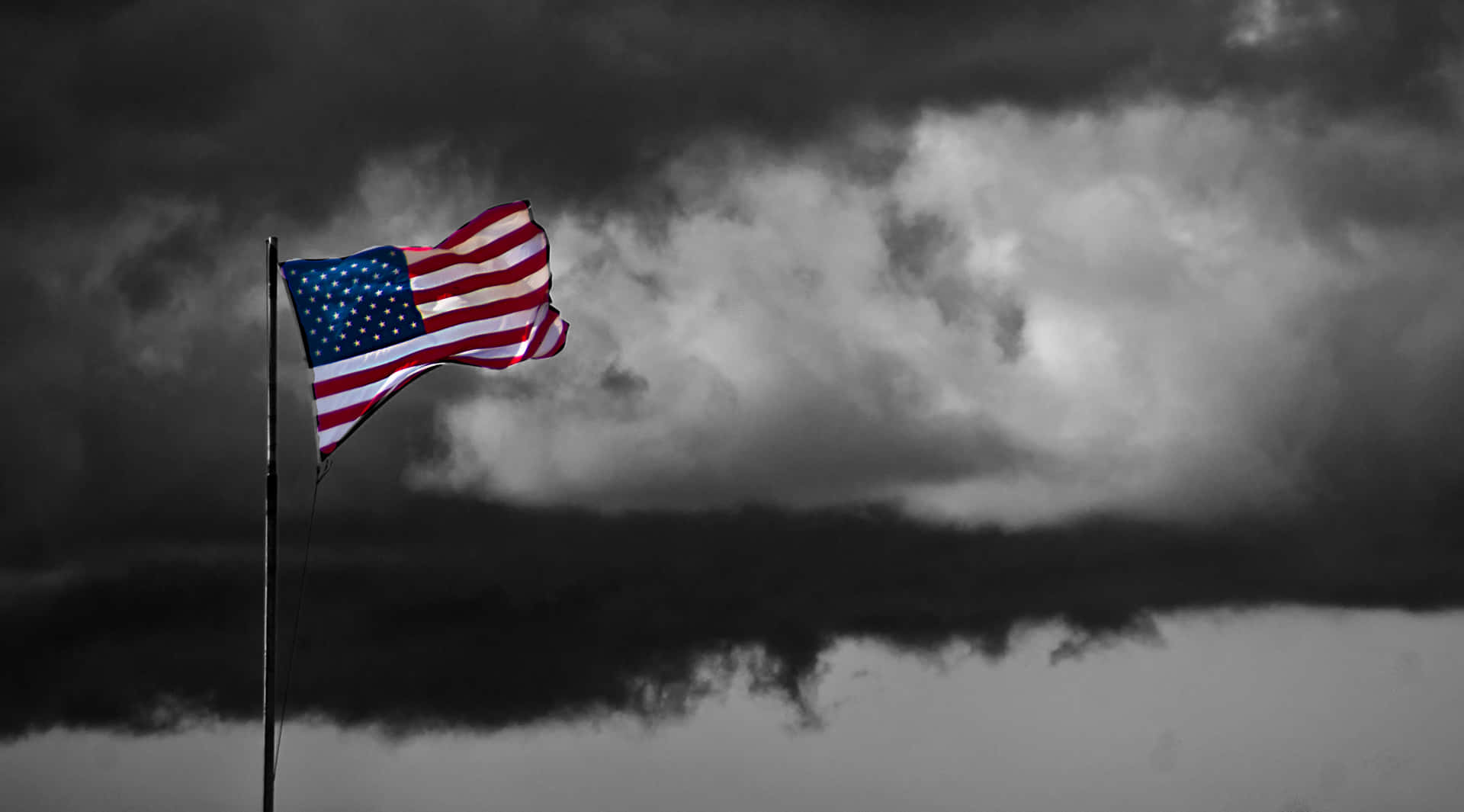 The United States Of America's Flag Waves Proudly Against A Vivid Sky Background