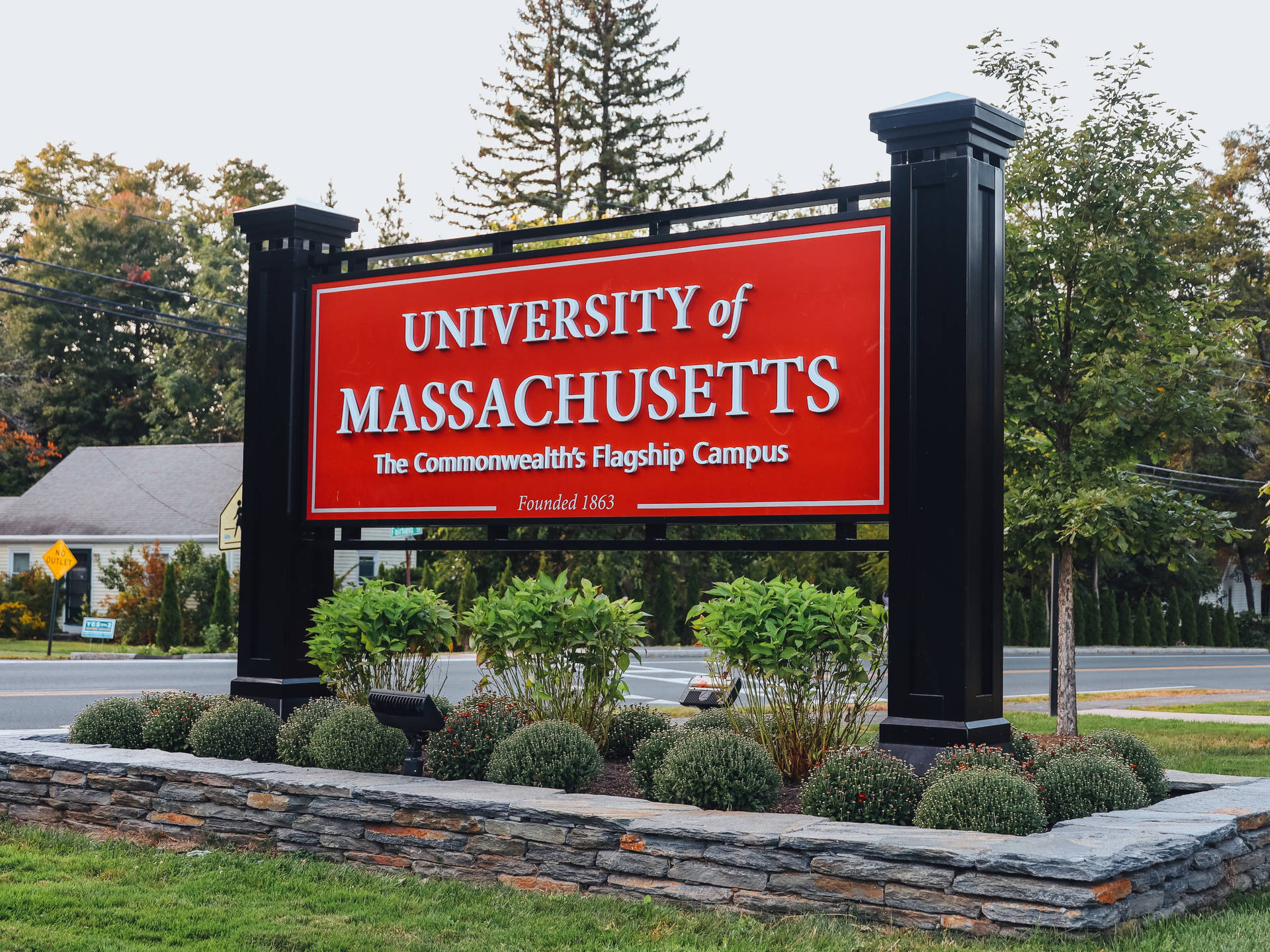 The University Of Massachusetts Official Campus Sign Background