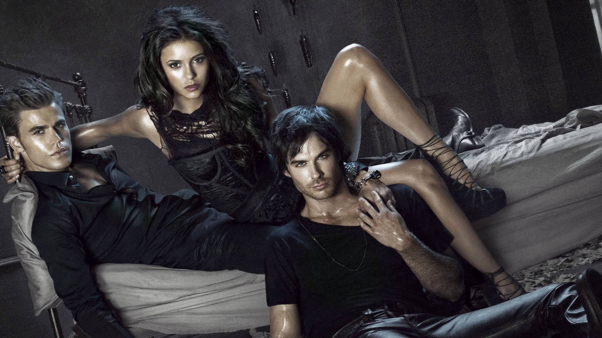 The Vampire Diaries Characters On Bed Background