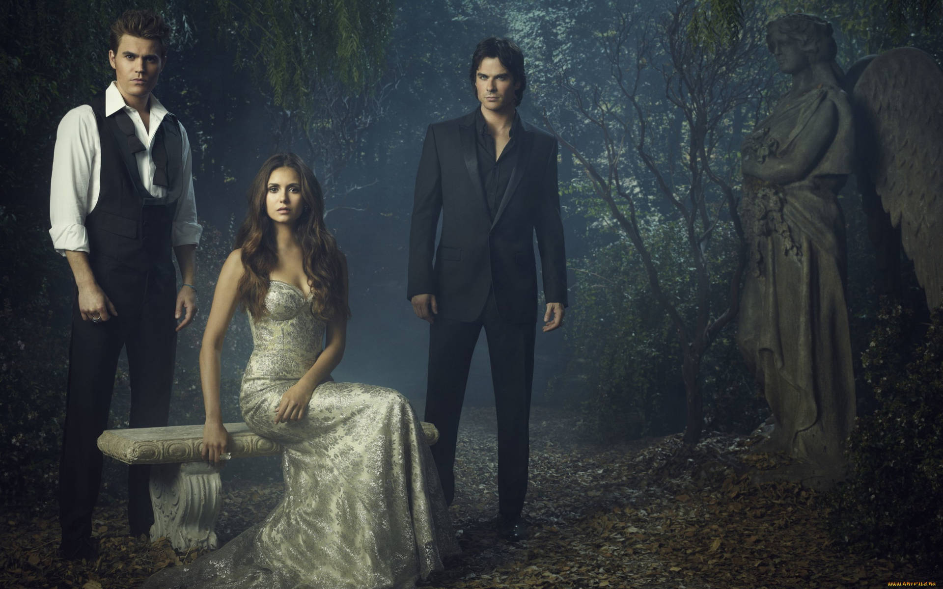 The Vampire Diaries Characters Posing With Angel Statue Background
