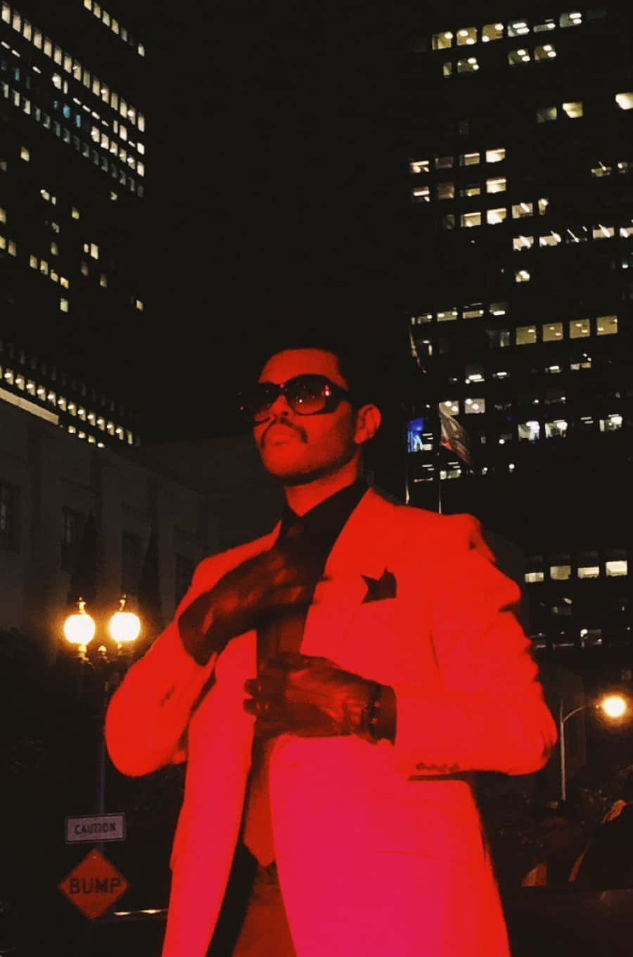 The Weeknd Posing In Red Suit During The After Hours Era Background