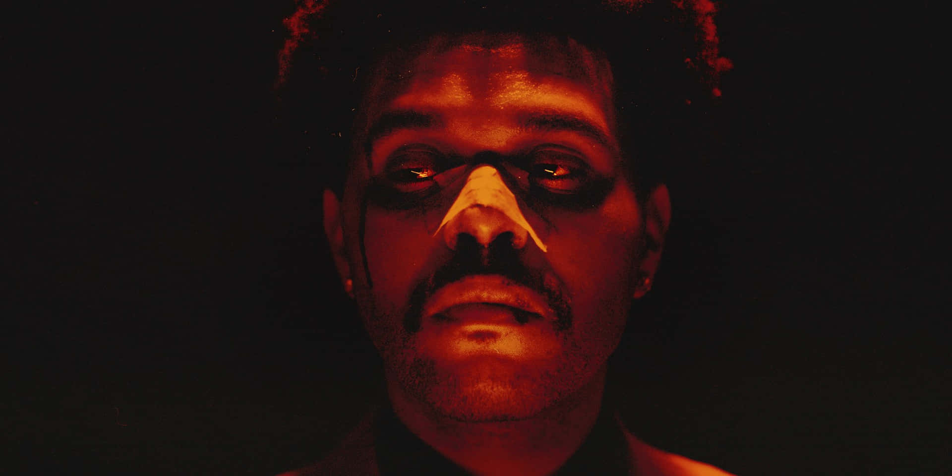 The Weeknd's After Hours Album Artwork Featuring A Bold And Enigmatic Portrait Background