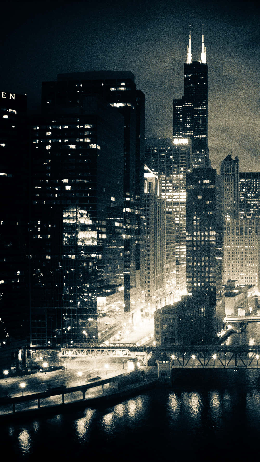 The Windy City: An Incredible Skyline Of Chicago, Il At Night Background