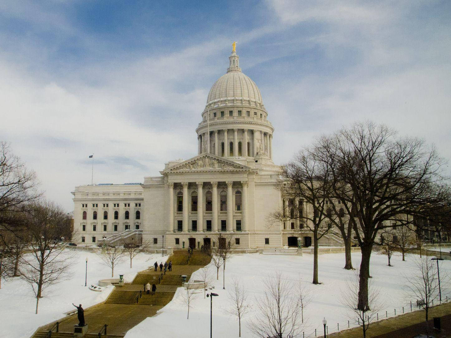 The Wisconsin State Capitol In Madison With Snow Background
