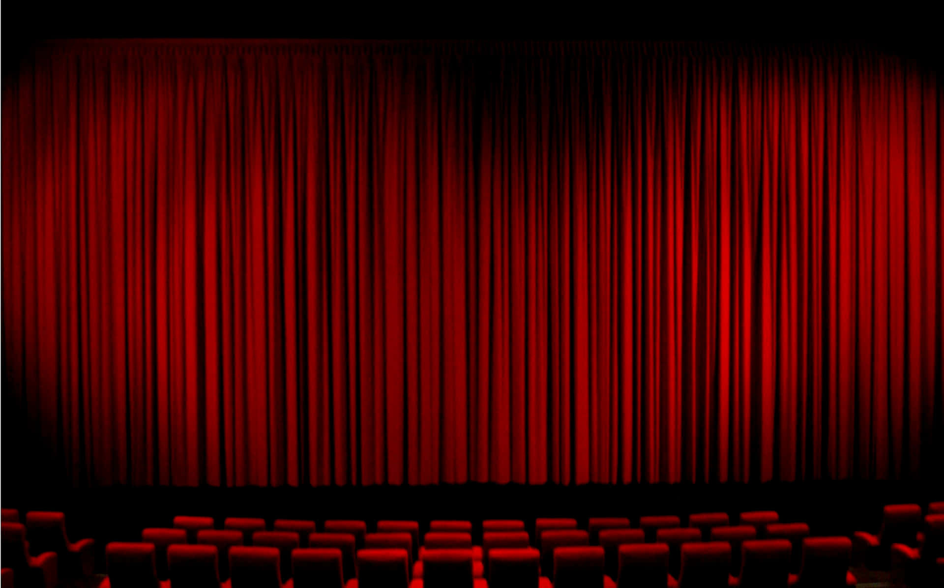 Theater With Red Curtains And Red Chairs