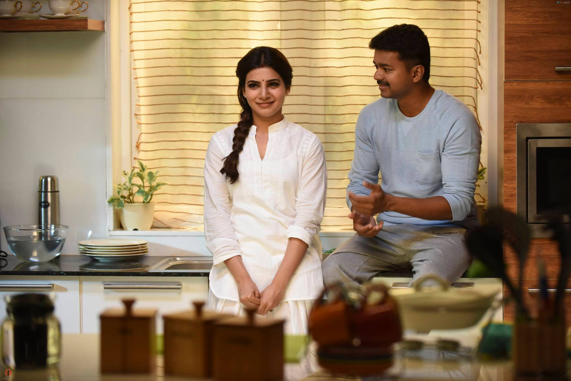 Theri Movie - A Charming Scene Of Love In The Kitchen Background