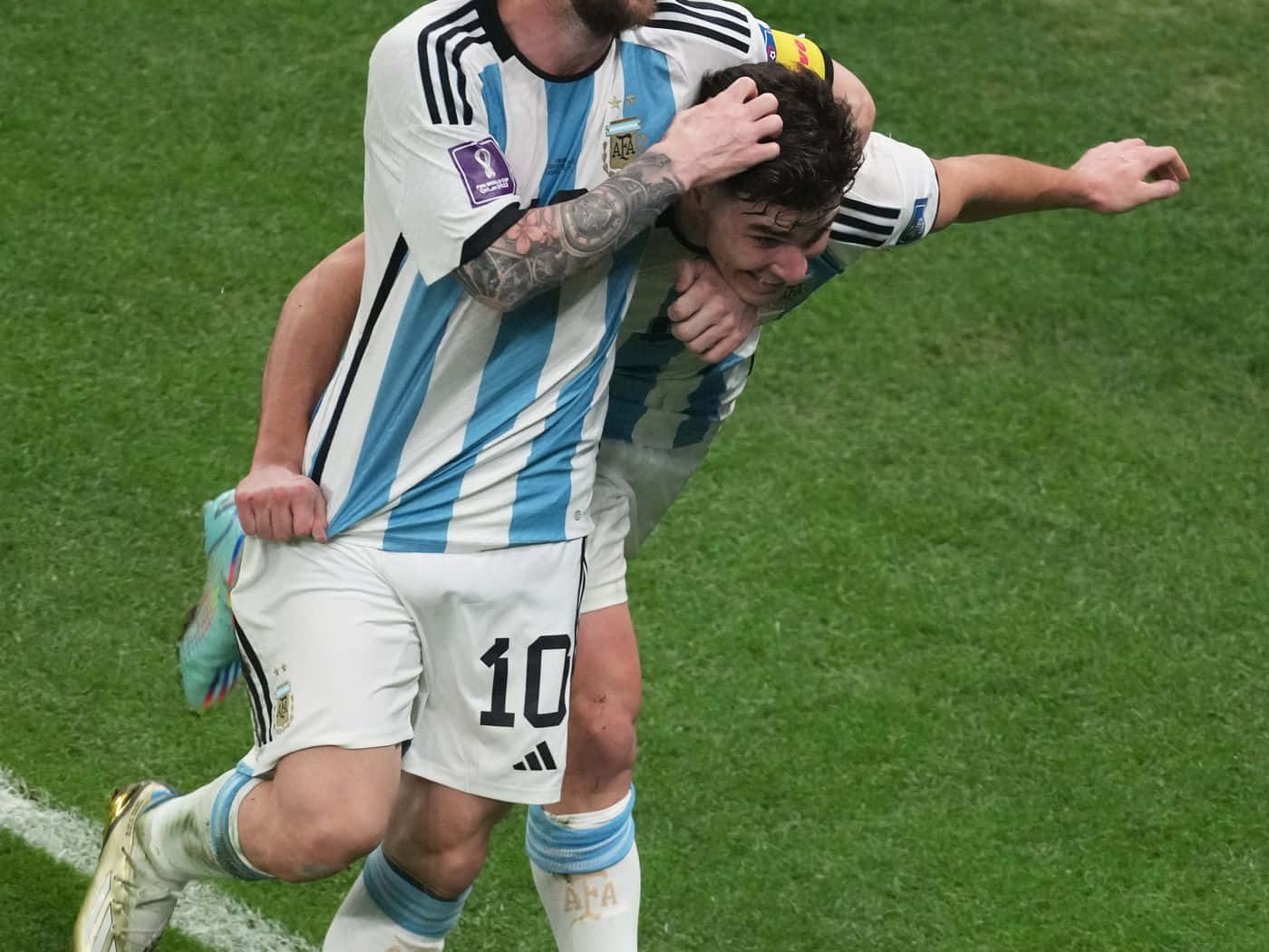 Thiago Almada Celebrating With Teammate Background