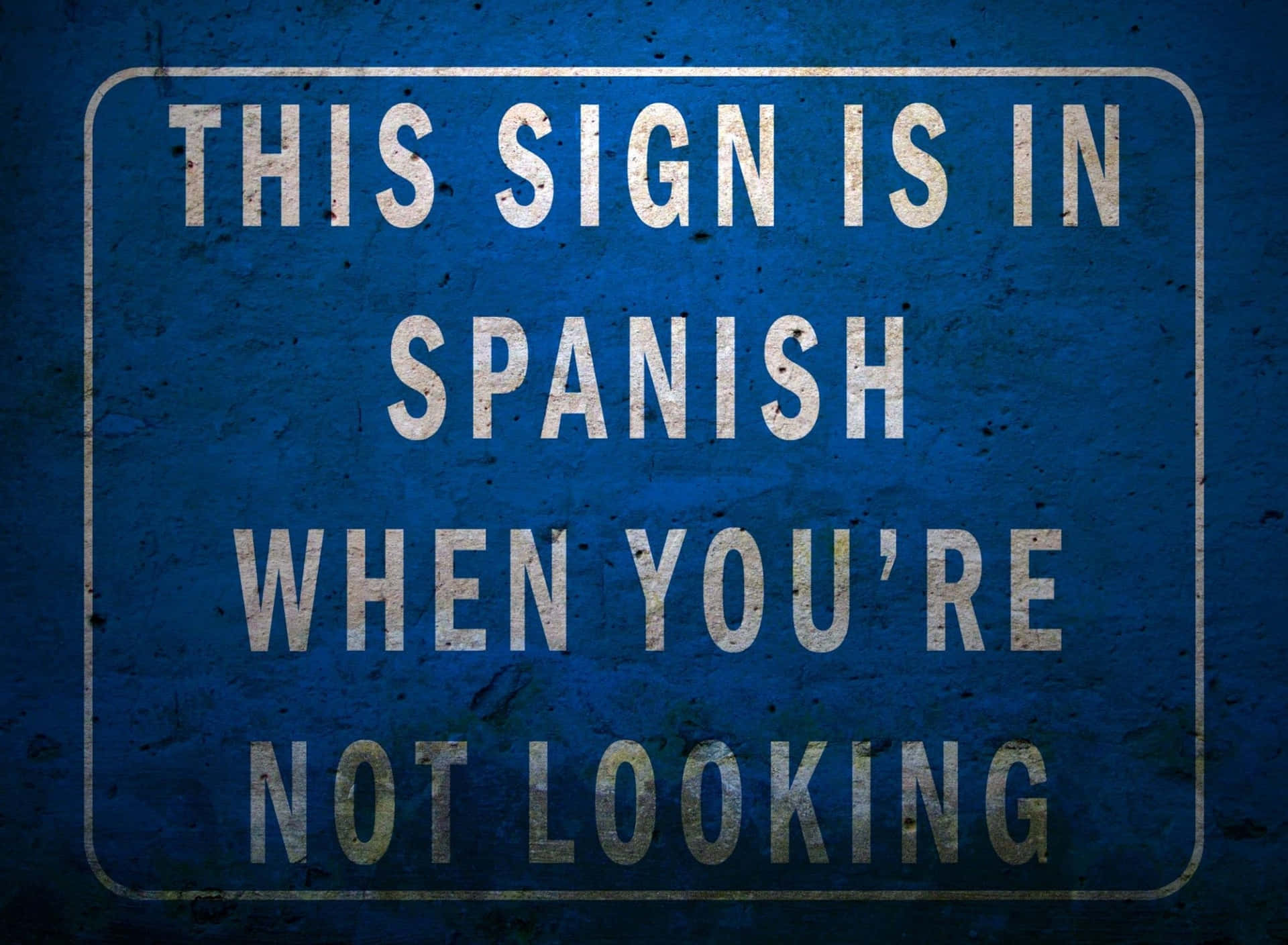 This Sign Is In Spanish When You're Not Looking Background