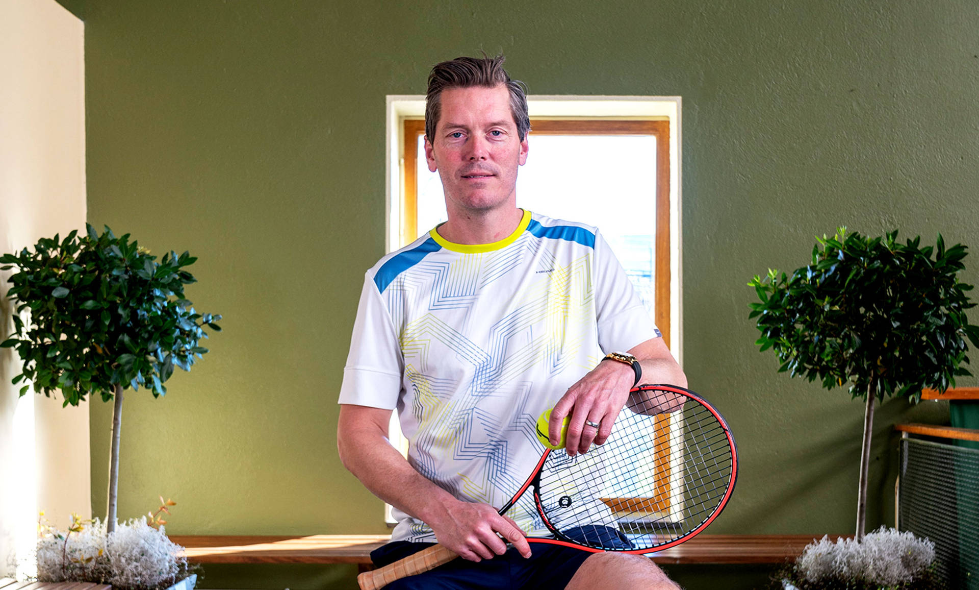 Thomas Enqvist Posing With Tennis Racket Background