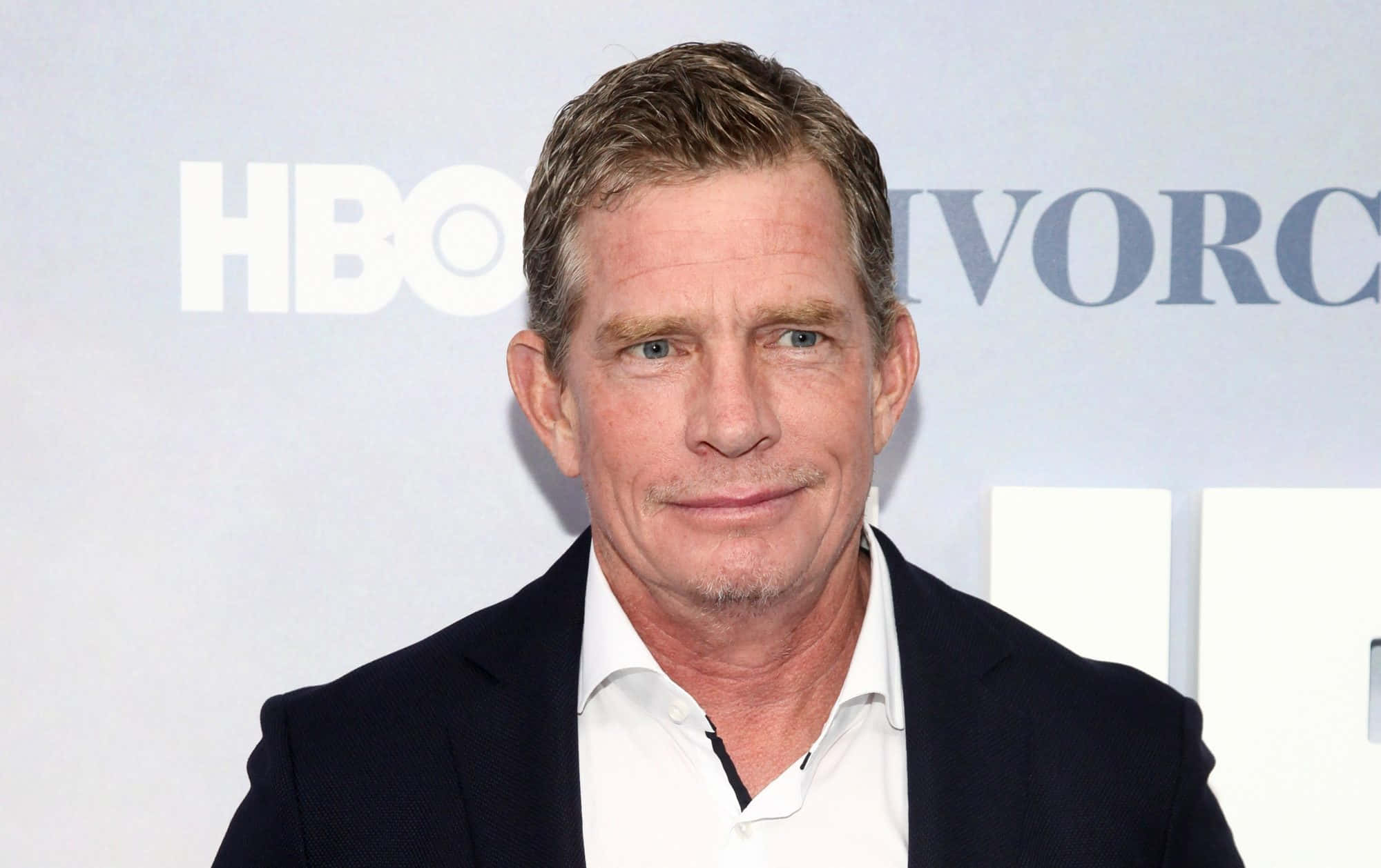 Thomas Haden Church Posing For A Professional Photoshoot Background
