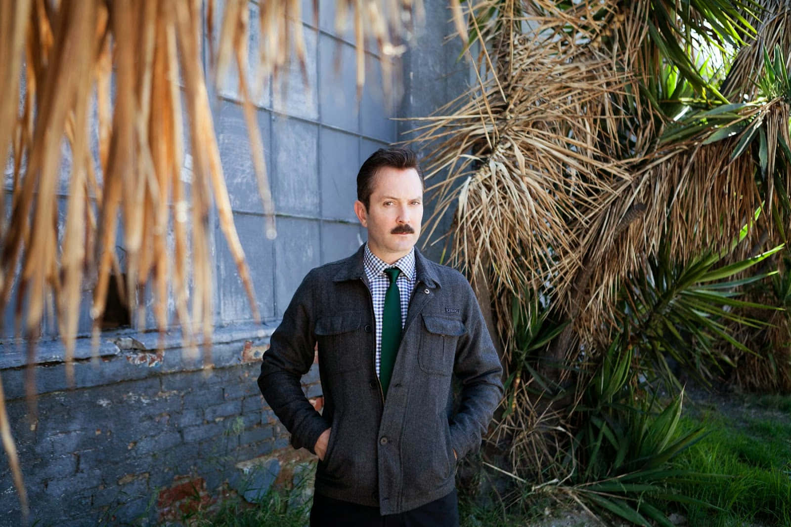 Thomas Lennon In An Outdoor Setting Background