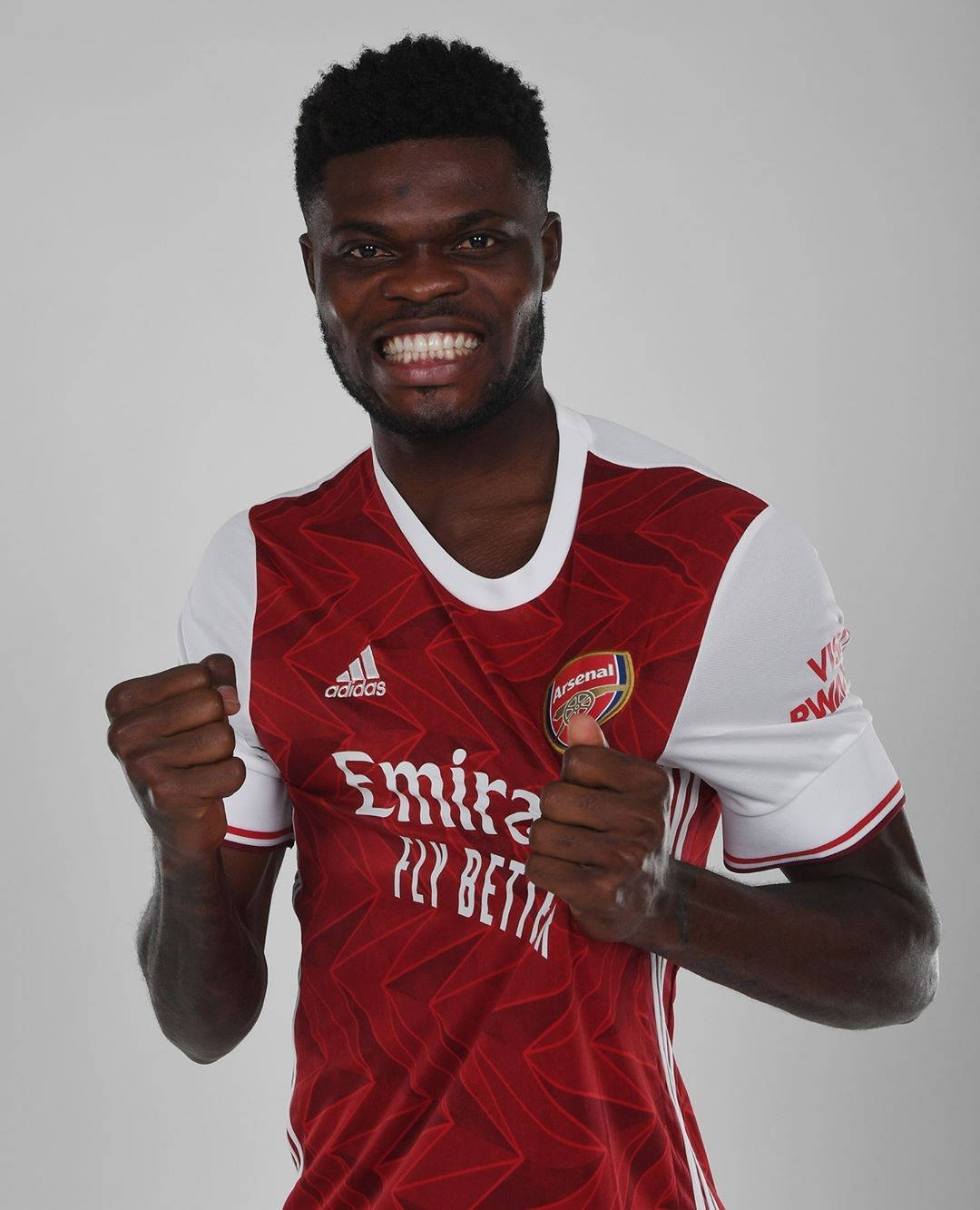 Thomas Partey Cheering With A White Backdrop Background