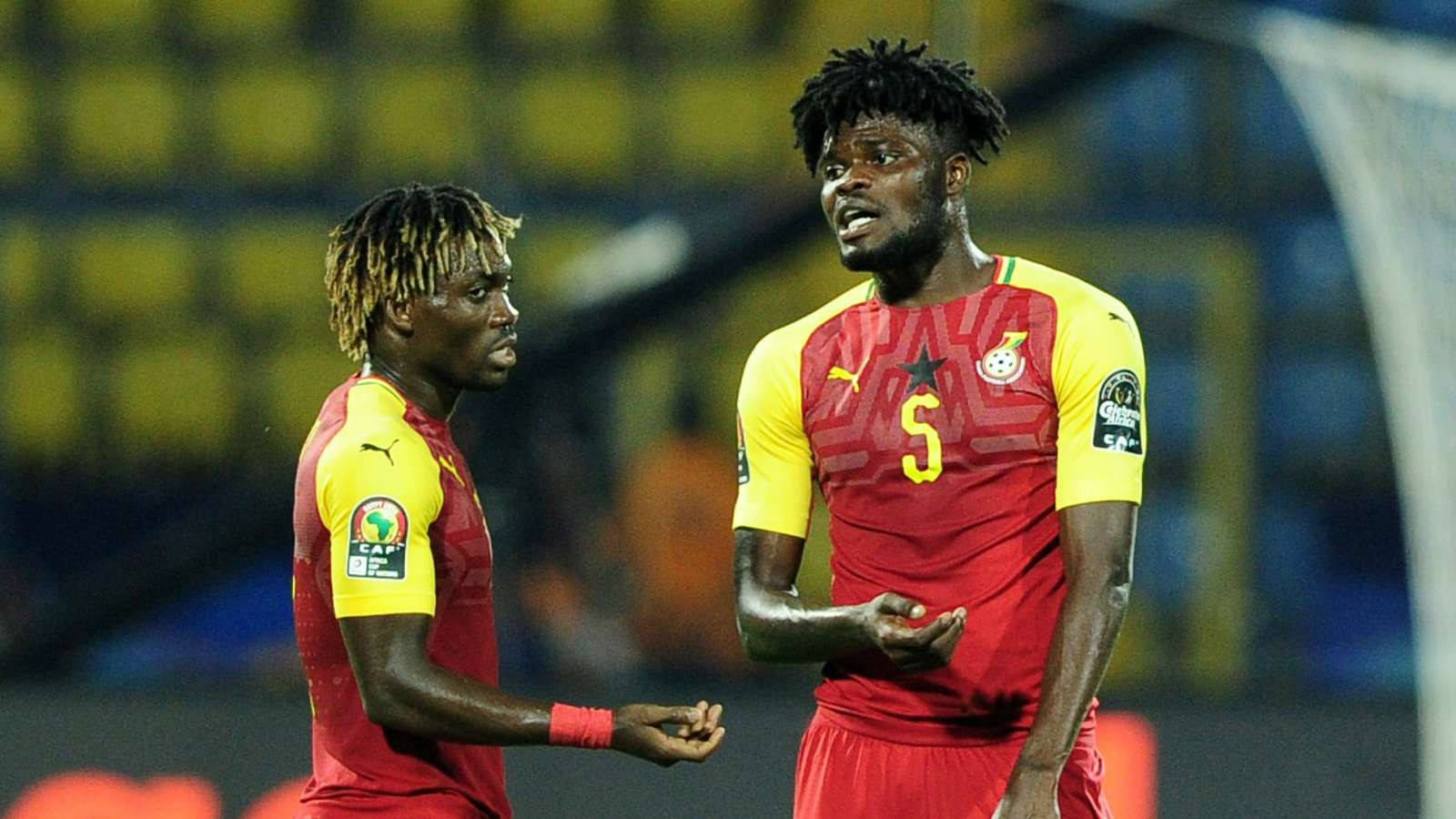 Thomas Partey With Another Player In A Red Uniform Background