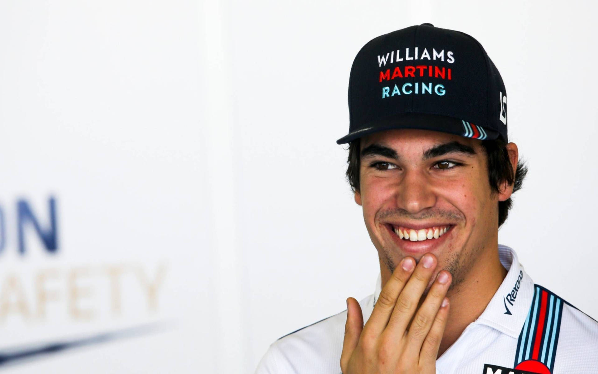 Thoughtful Lance Stroll Pondering On Strategies Background