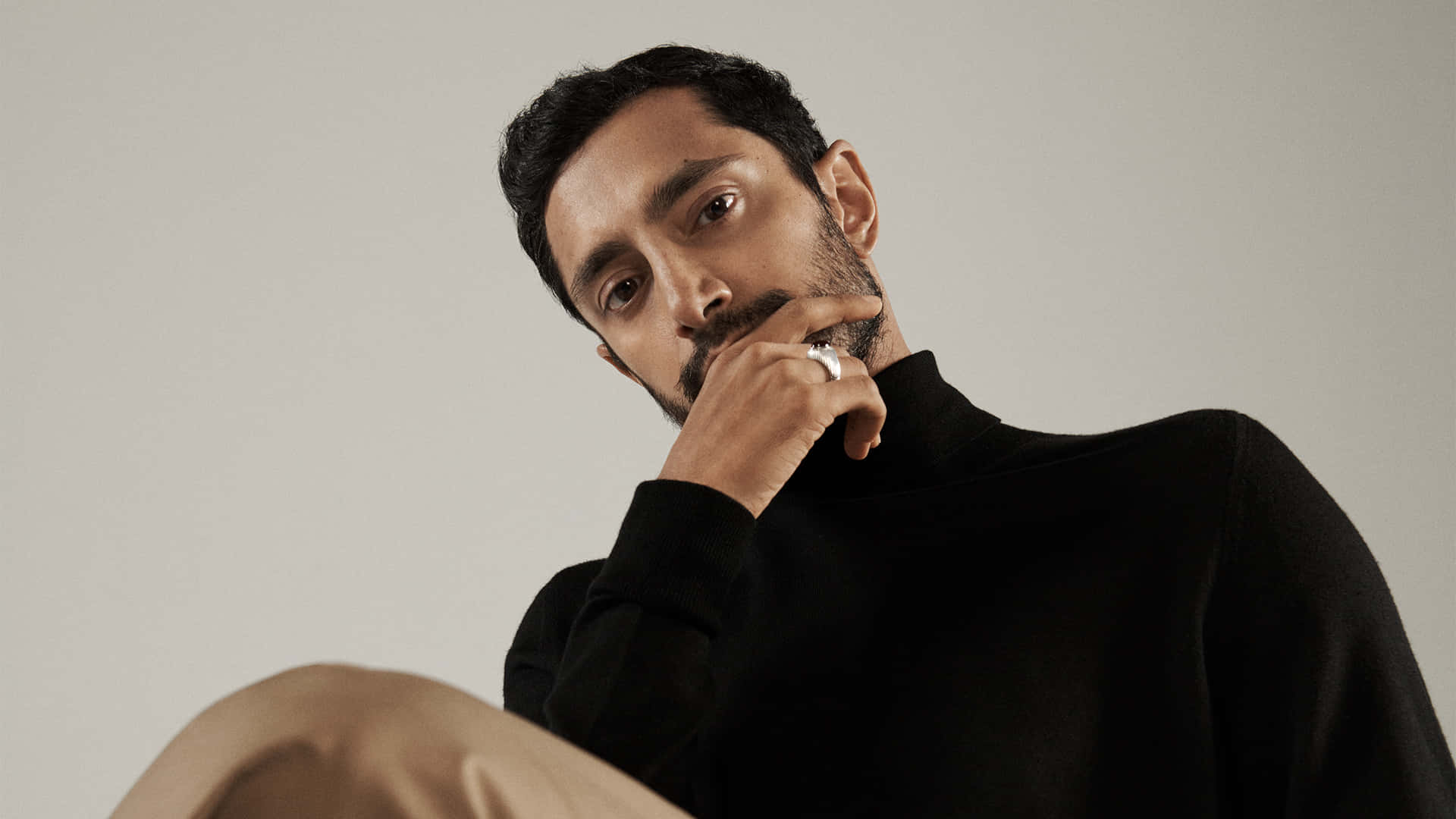 Thoughtful_ Man_in_ Black_ Turtleneck Background