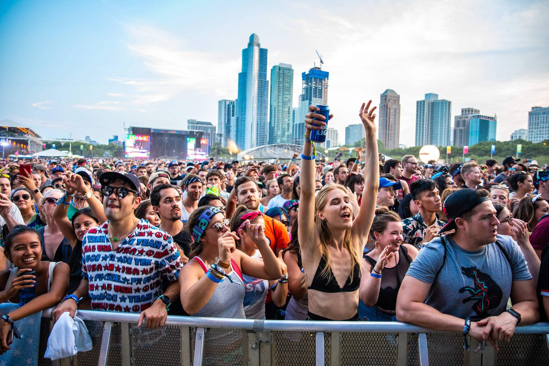 Thousands Of Fans Having A Great Time Enjoying The Music At Lollapalooza In Chicago Background