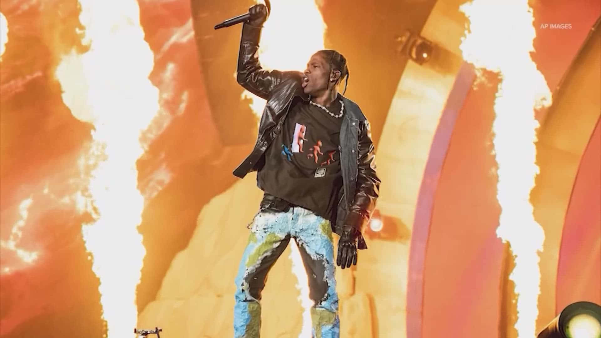 Thousands Of Fans Join In Person And Online To Experience Travis Scott's Electrifying Concert Background