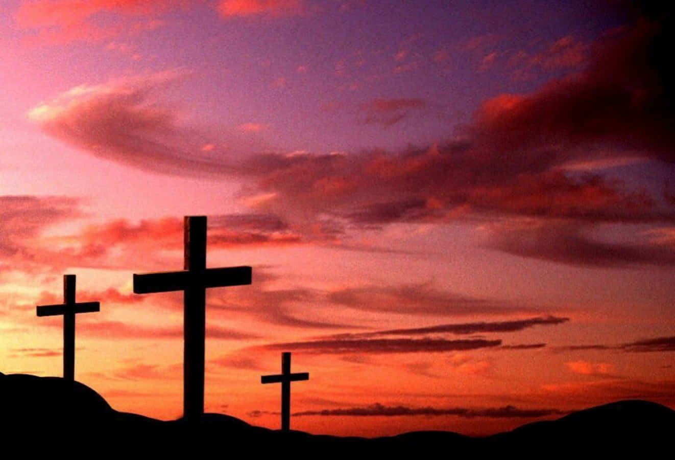 Three Beautiful Cross Silhouettes With Sunset Sky Background