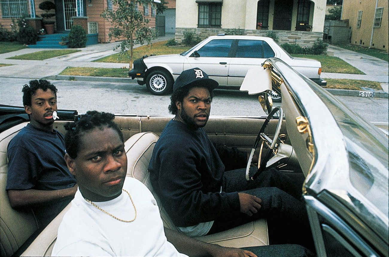 Three Boys Stand Atop A Hill In South Central Los Angeles In Boyz N The Hood Background
