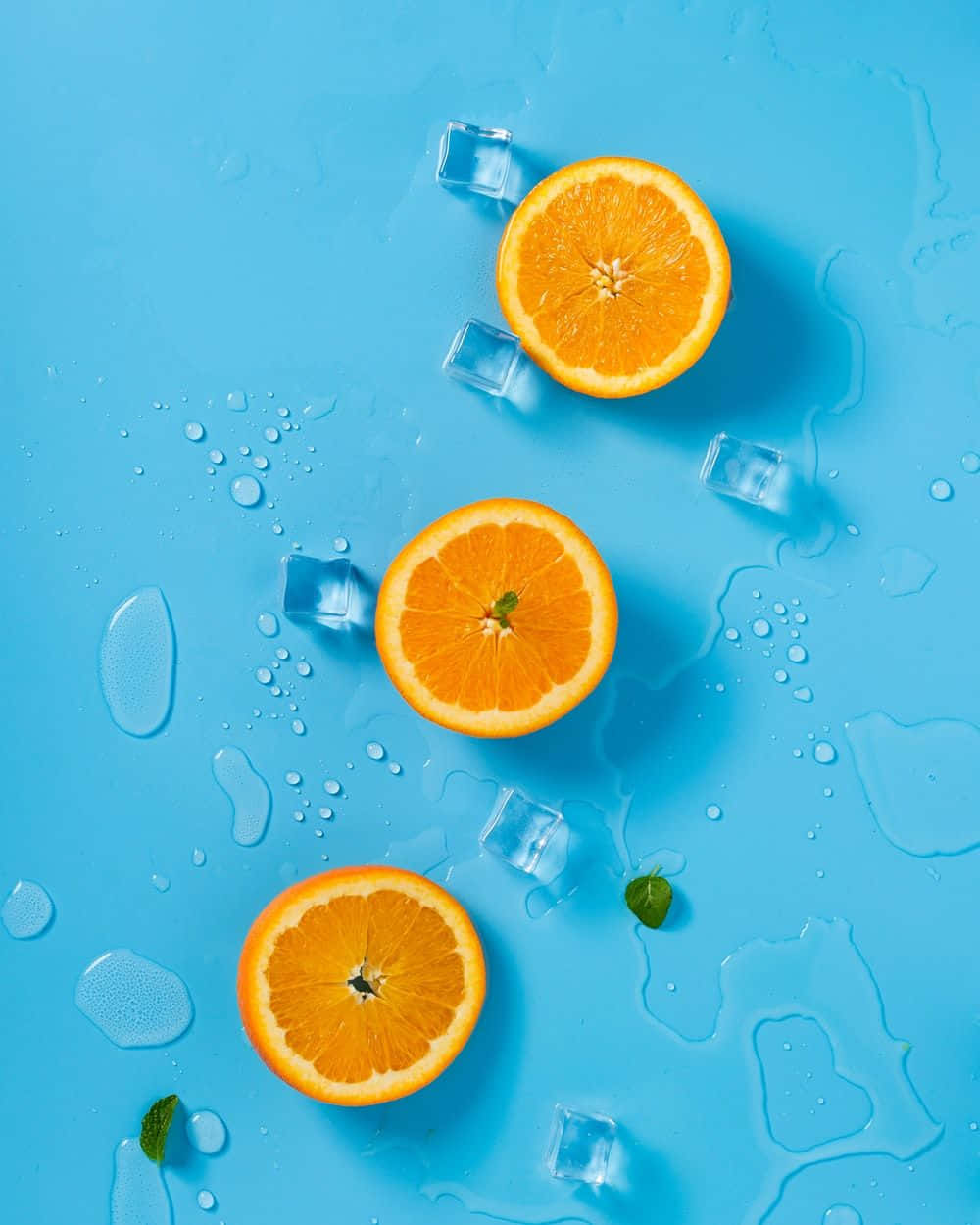 Three Cute Orange Slices With Ice Background