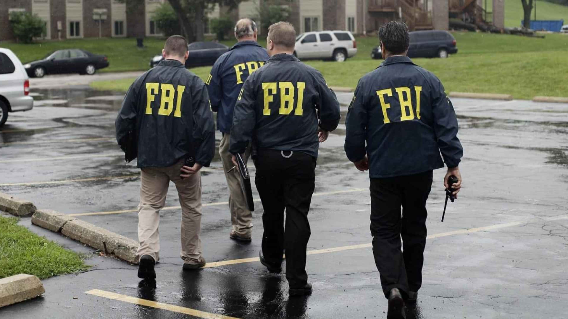 Three Fbi Agents Walking In The Rain Background