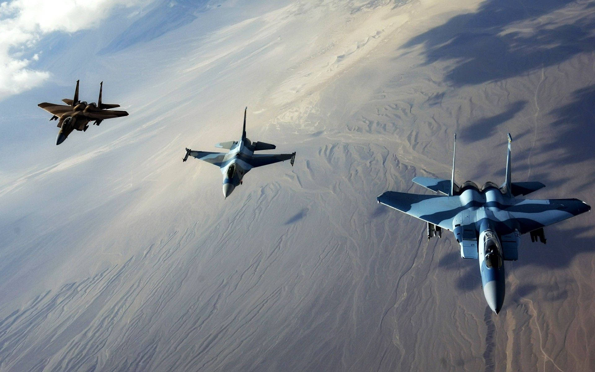 Three Fighter Jets Flying In The Sky Background