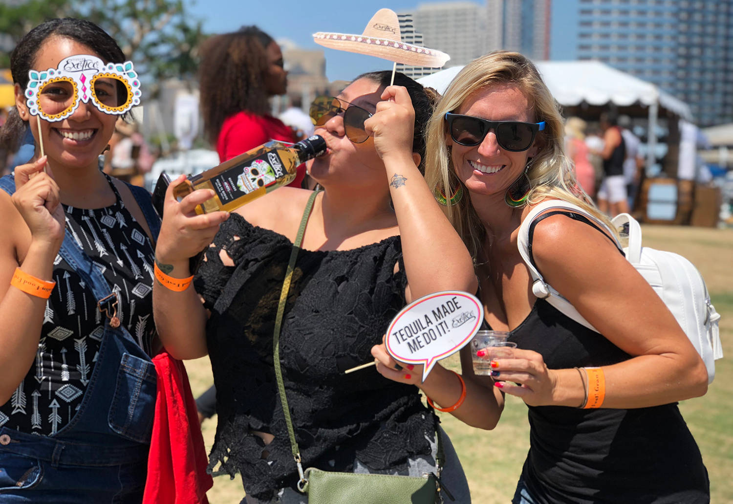 Three Girls With Exotico Tequila Background