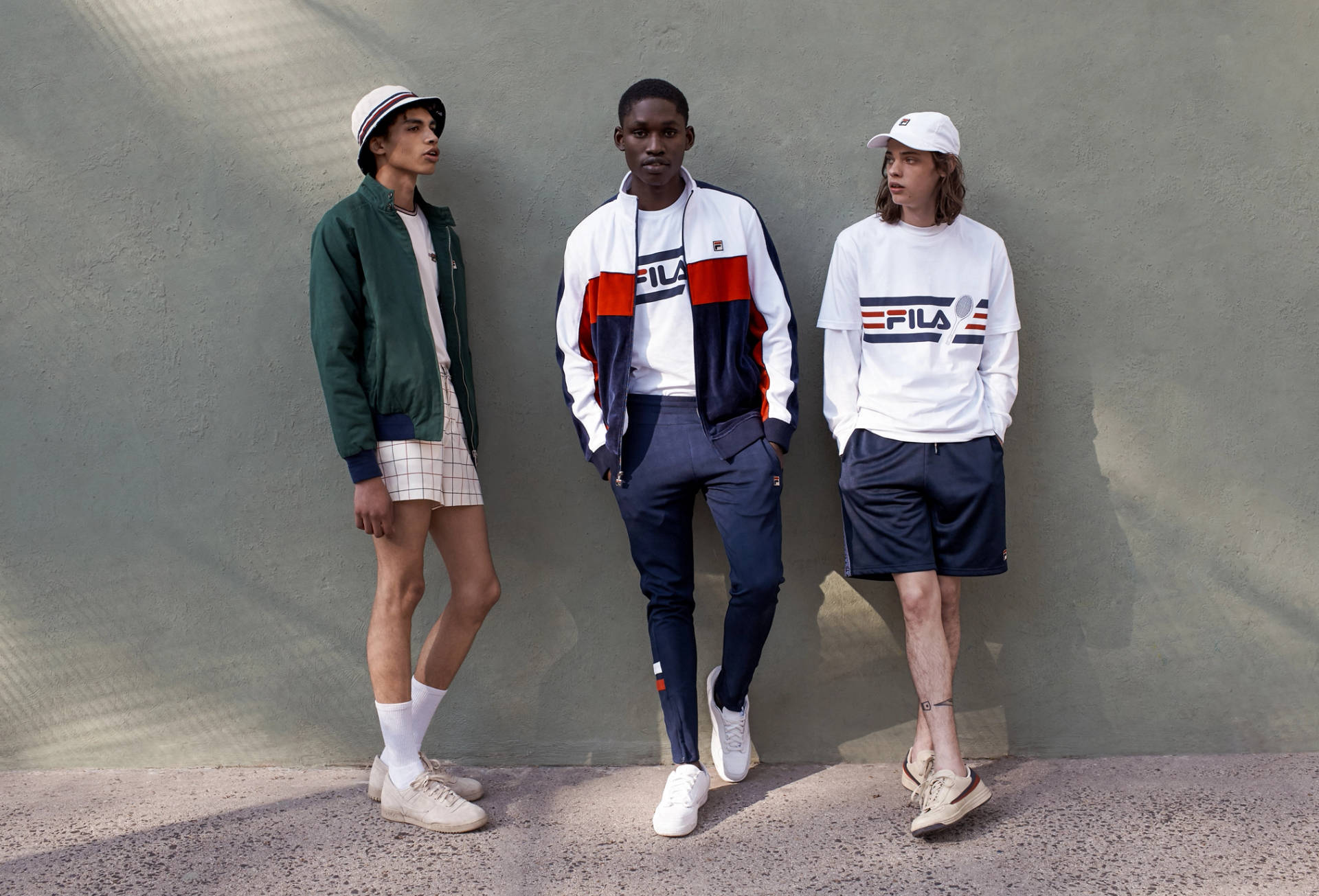 Three Guys Wearing Fila Background