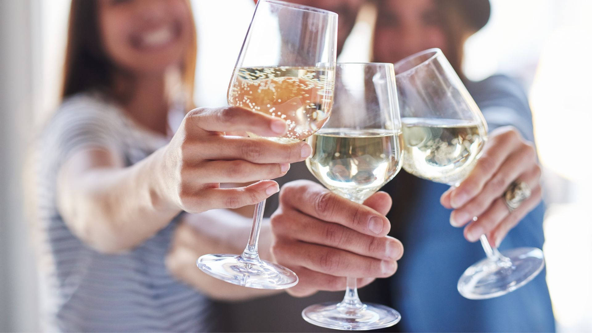 Three Ladies Clinking Glasses Of Alcohol Background