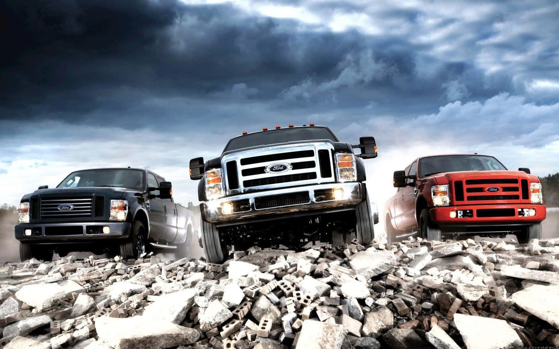 Three Lifted Trucks On Rocky Terrain Background